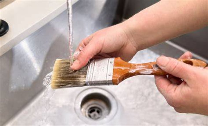 Is it safe to wash paint brushes in the kitchen sink?